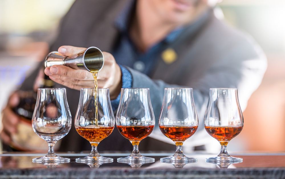 Pouring a flight of whisky tastings